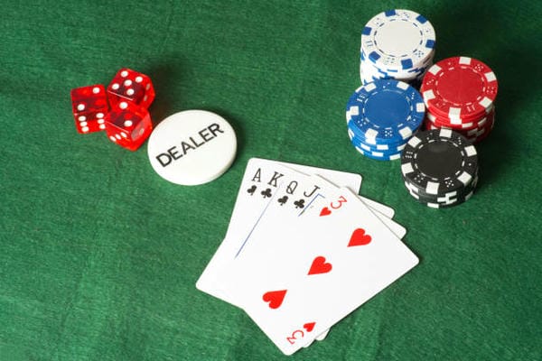 Playing cards and game tokens in casino